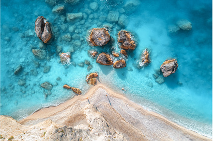Aerial view of blue sea, rocks in, a Nature Photo by den-belitsky