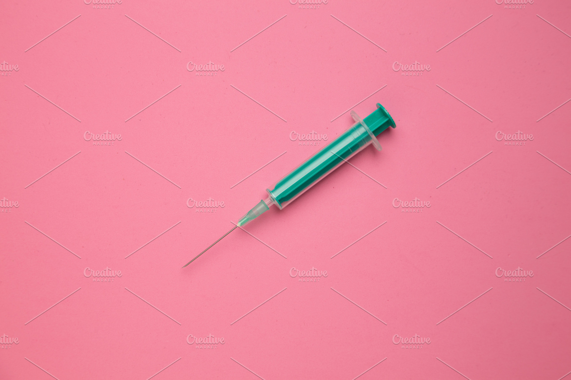 Medical syringe on colorful backgrou, a Background Photo by robcar