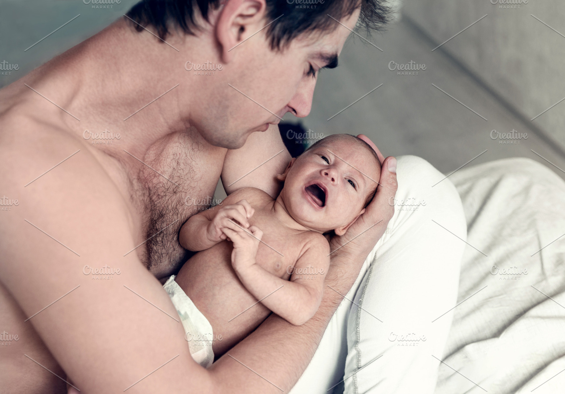 the father holds a newborn son, a Person Photo by Eni_fly