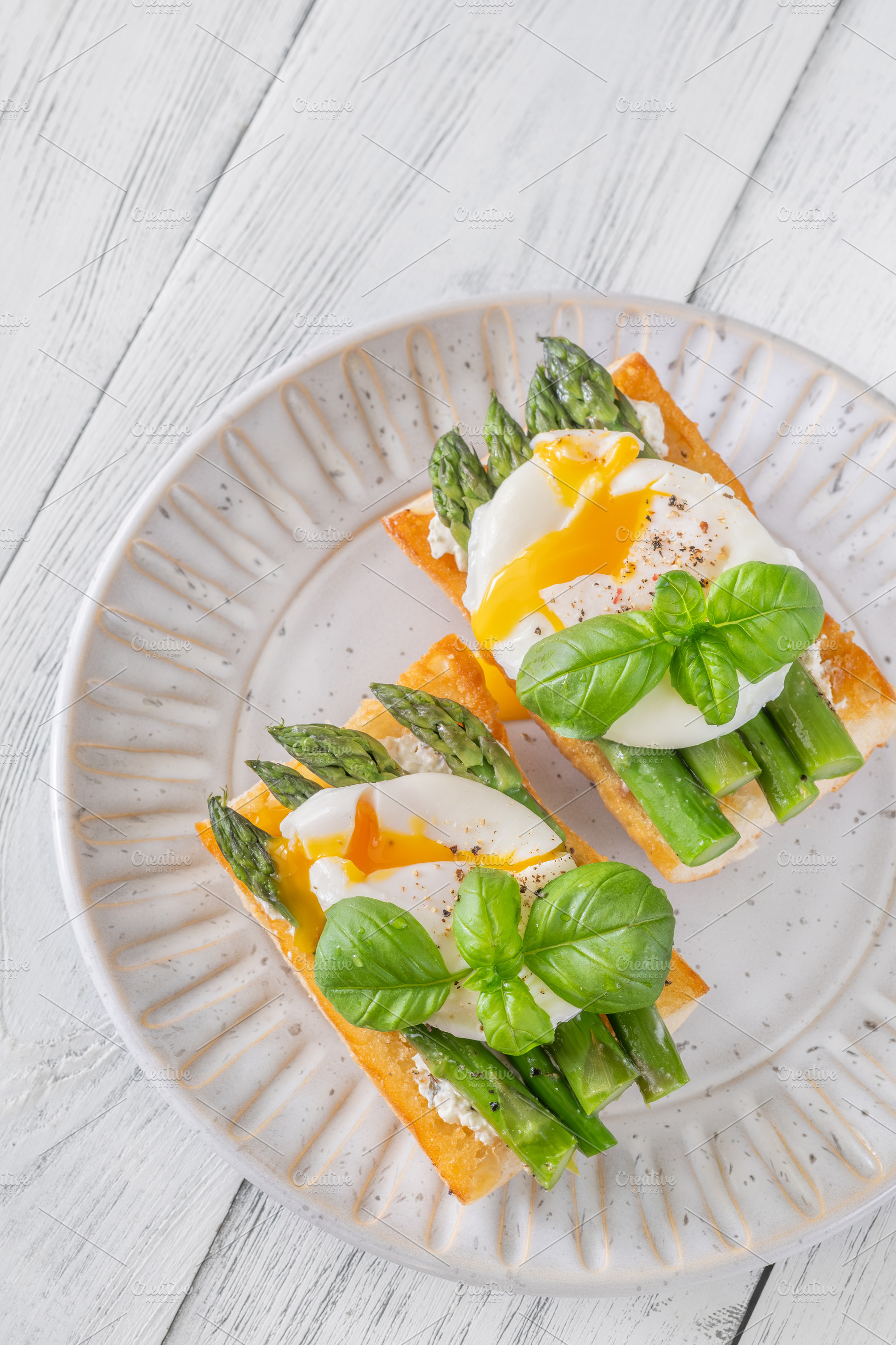 Gourmet Ciabatta Bruschetta With Runny Poached Eggs And Fresh As, a Food & Drink Photo by Alexander Prokopenko