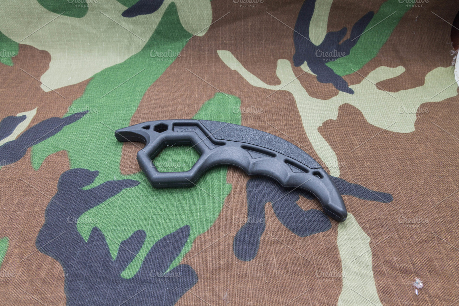 Knuckles on camouflage background., a Sports & Recreation Photo by Stockphoto by vzwer
