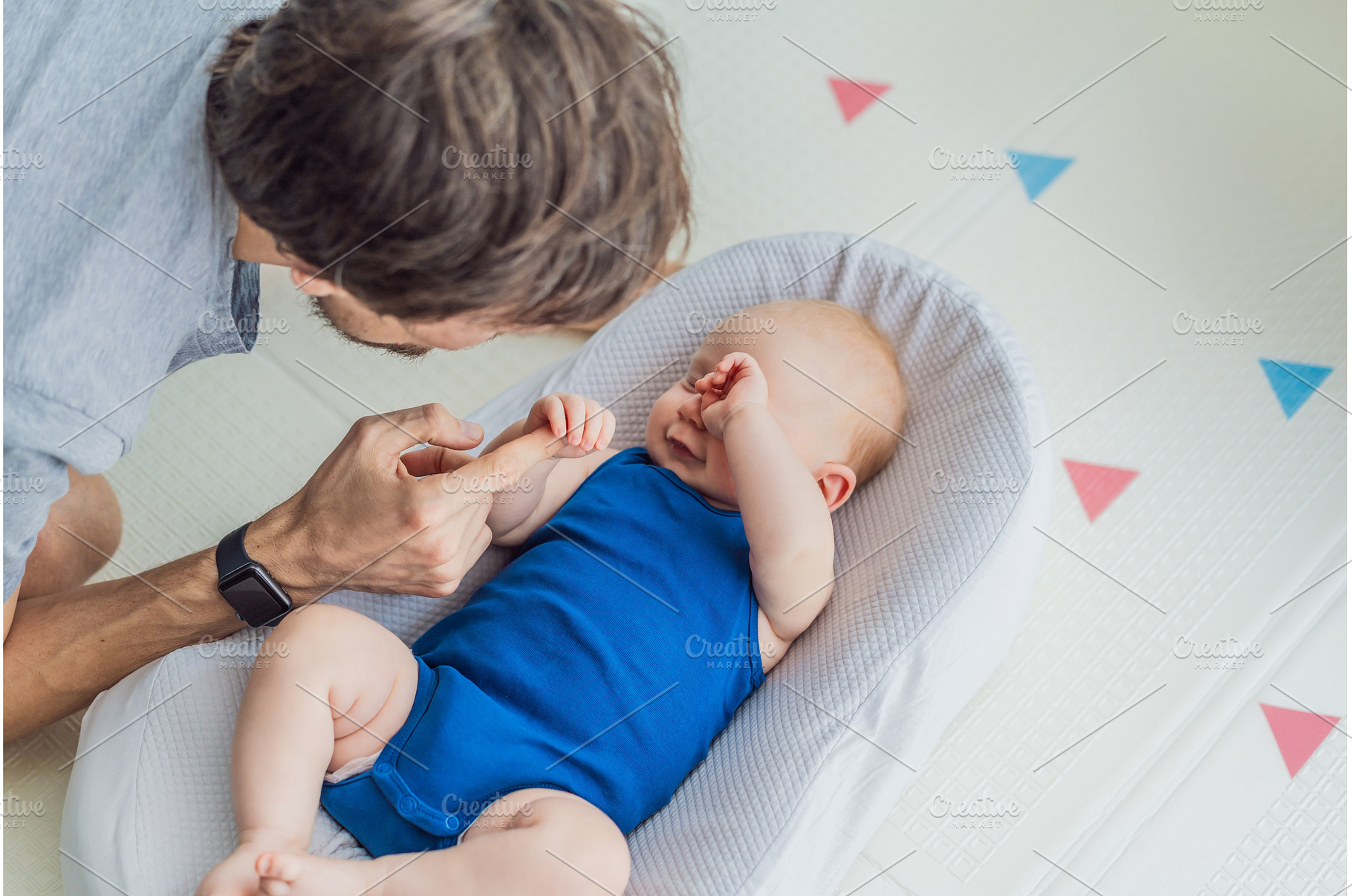 Loving father interacts with his 3, a Person Photo by Elizaveta Galitskaya