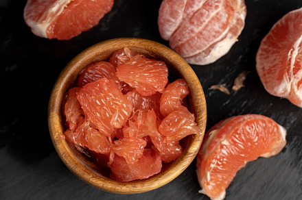 slices of peeled grapefruit close-up, a Photo by MyPhotos