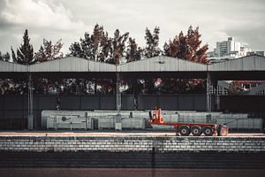 Industrial dock with orange trailer, an Industrial Photo by SkyNext
