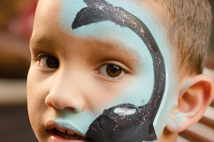 Child with painted face.