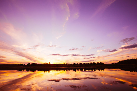Sunset on the river stock photo containing beach and blue, a Nature Photo by telnyaw