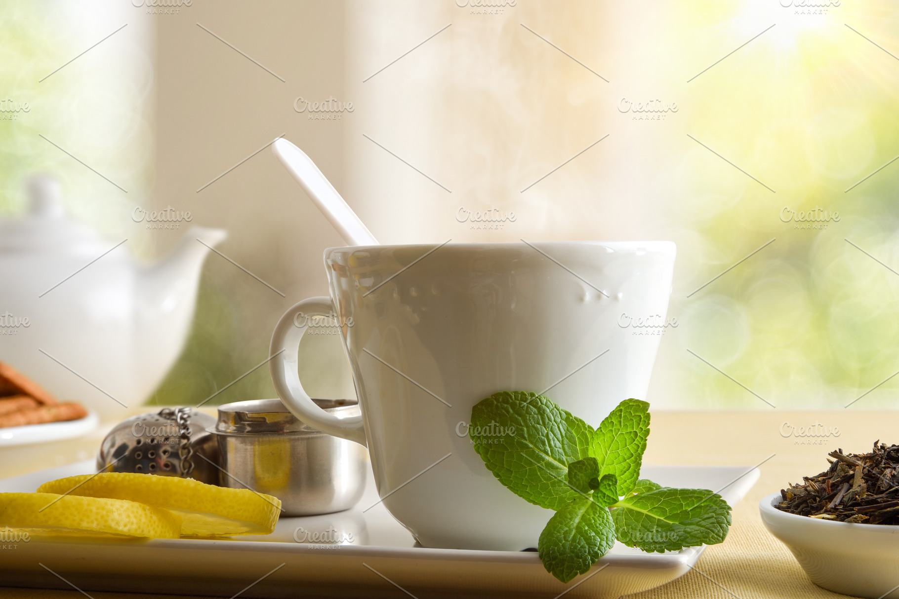 Macro teacup with mint and lemon in a lounge, a Food & Drink Photo by Davizro's Market