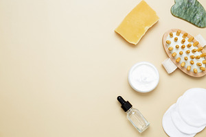 Skincare set with gua sha, wooden body brush, facial cream and serum for natura, a Photo by matucha