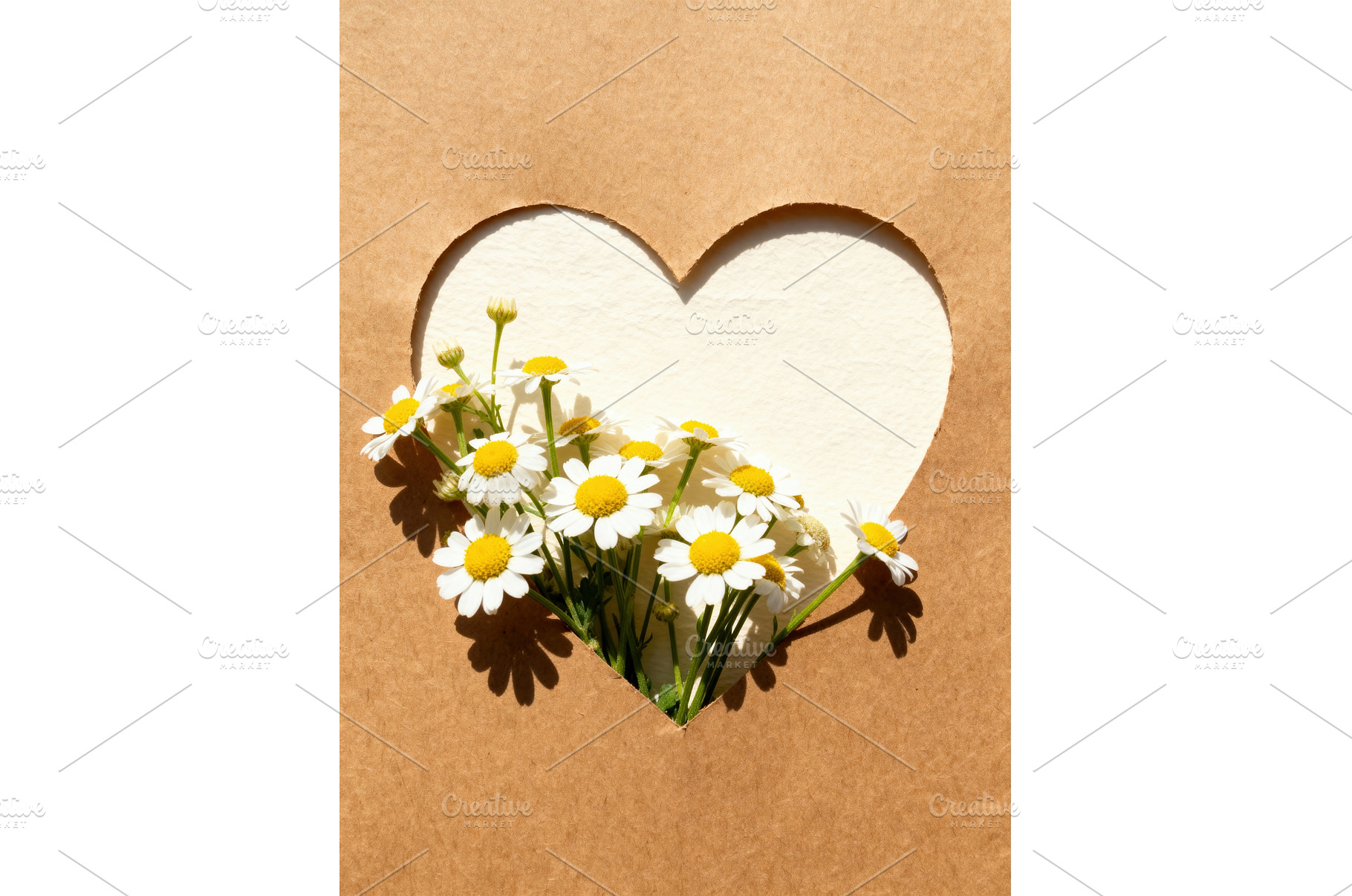 Heart-shaped cutout on brown paper, a Background Photo by tilialucida