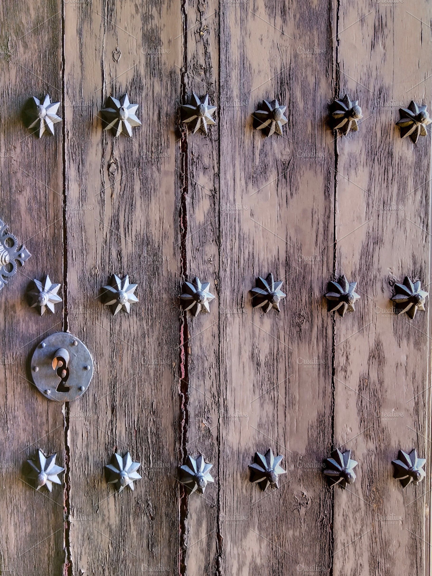 Old wooden door with metal studs, an Architecture Photo by DanFLCreativo