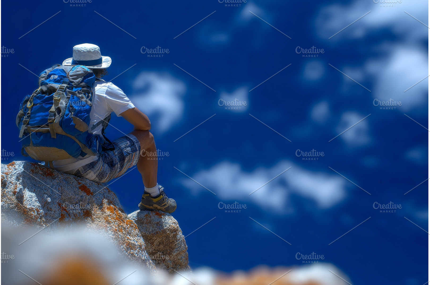 A man on a mountain hiking trip sits, a Person Photo by ZinetroN