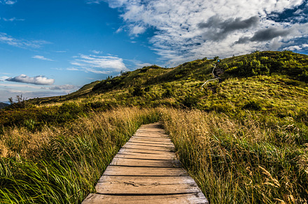 Mountain trail stock photo containing hill and cloud