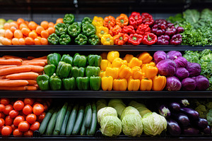 Colorful fresh vegetables display in supermarket, a Food & Drink Photo by AlyaAnd