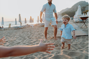 A small toddler boy standing on, a Person Photo by HalfPoint