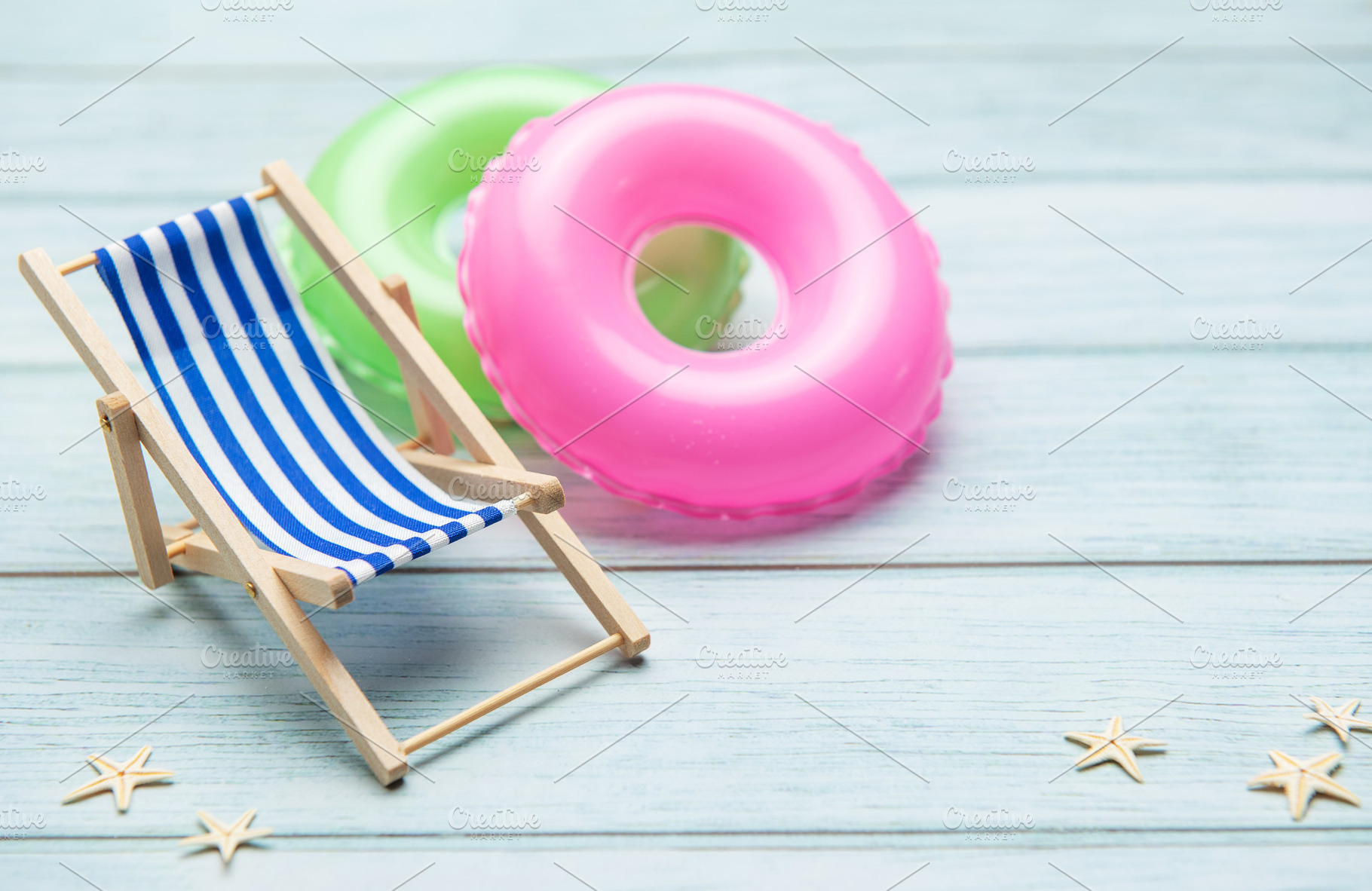 Relaxing beach vibes with colorful pool floats, a Holiday Photo by Olena Rudo