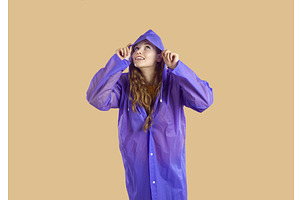 Smiling Woman In Purple Coat Peeks