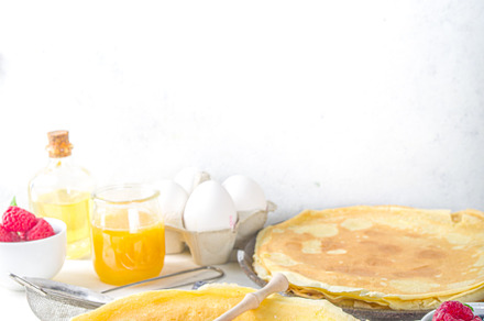 Crepes pancakes with berries, a Background Photo by Rimma