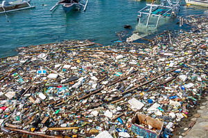 Floating waste pollution in Bira harbor, Sulawesi, Indonesia, a Nature Photo by GoodGoods