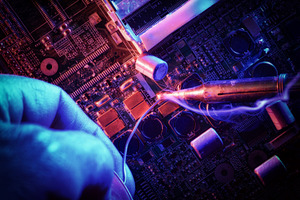 Precision Soldering on Computer Motherboard Circuit, a Technology Photo by Davizro's Market