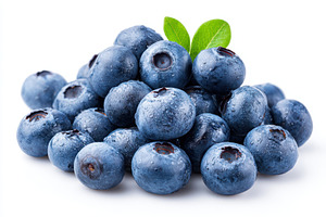 Fresh blueberries with leaves on white background, a Food & Drink Photo by AlyaAnd