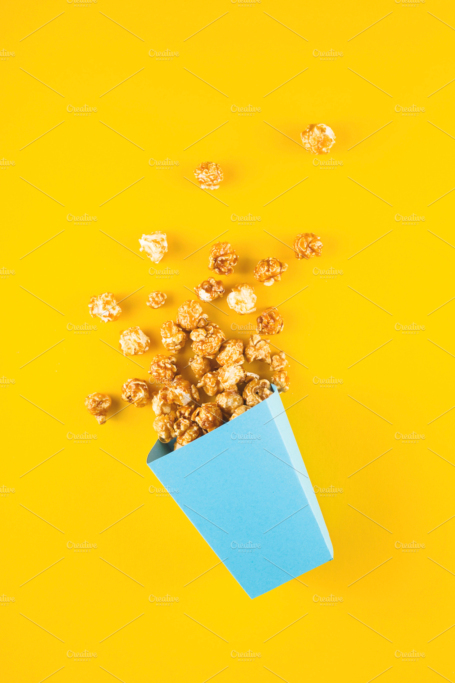 Sweet popcorn in a blue box, a Food & Drink Photo by Valeriia • Svitlini