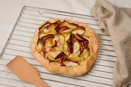 Homemade apple and plum galette table for teatime, a Food & Drink Photo by vimart