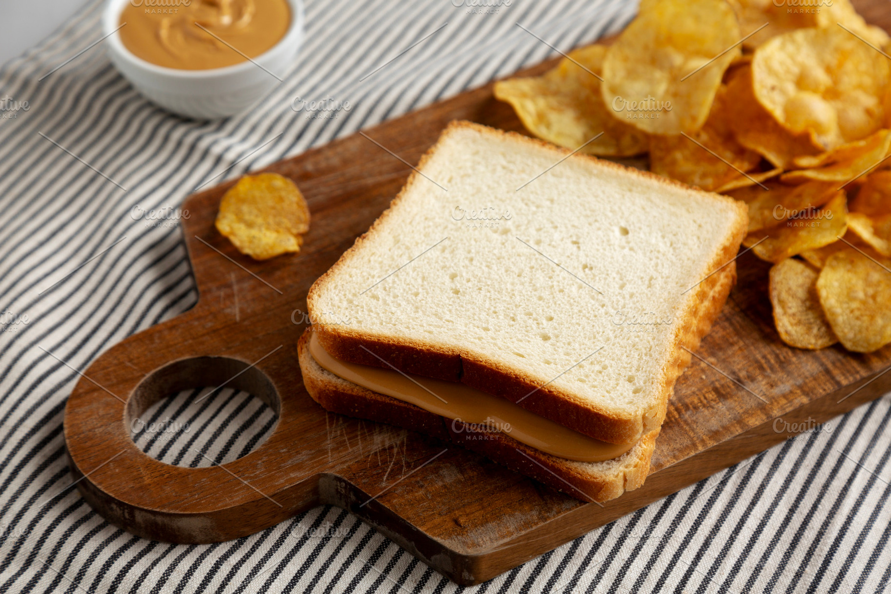 Homemade American Peanut Butter Sandwich on a Wooden Board, side, a Food & Drink Photo by LiudmylaChuhunova