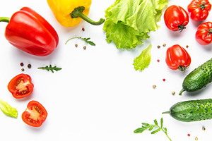 Fresh vegetables forming a nutritional food frame on white, a Food & Drink Photo by Olena Rudo