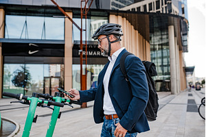 Businessman unlocking electric, a Transportation Photo by HalfPoint