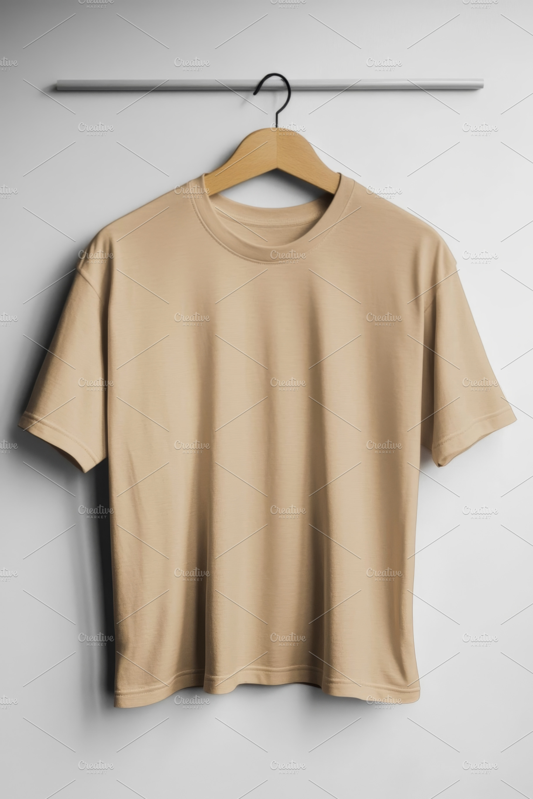 Beige T-Shirt Hanging on Wooden Hanger, an Abstract Photo by Natalia Klenova's Shop