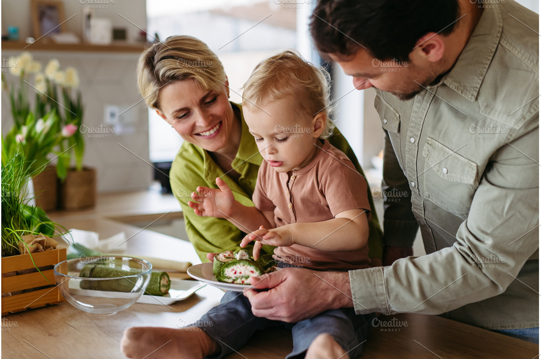 Family eating green dishes as a, a Food & Drink Photo by HalfPoint