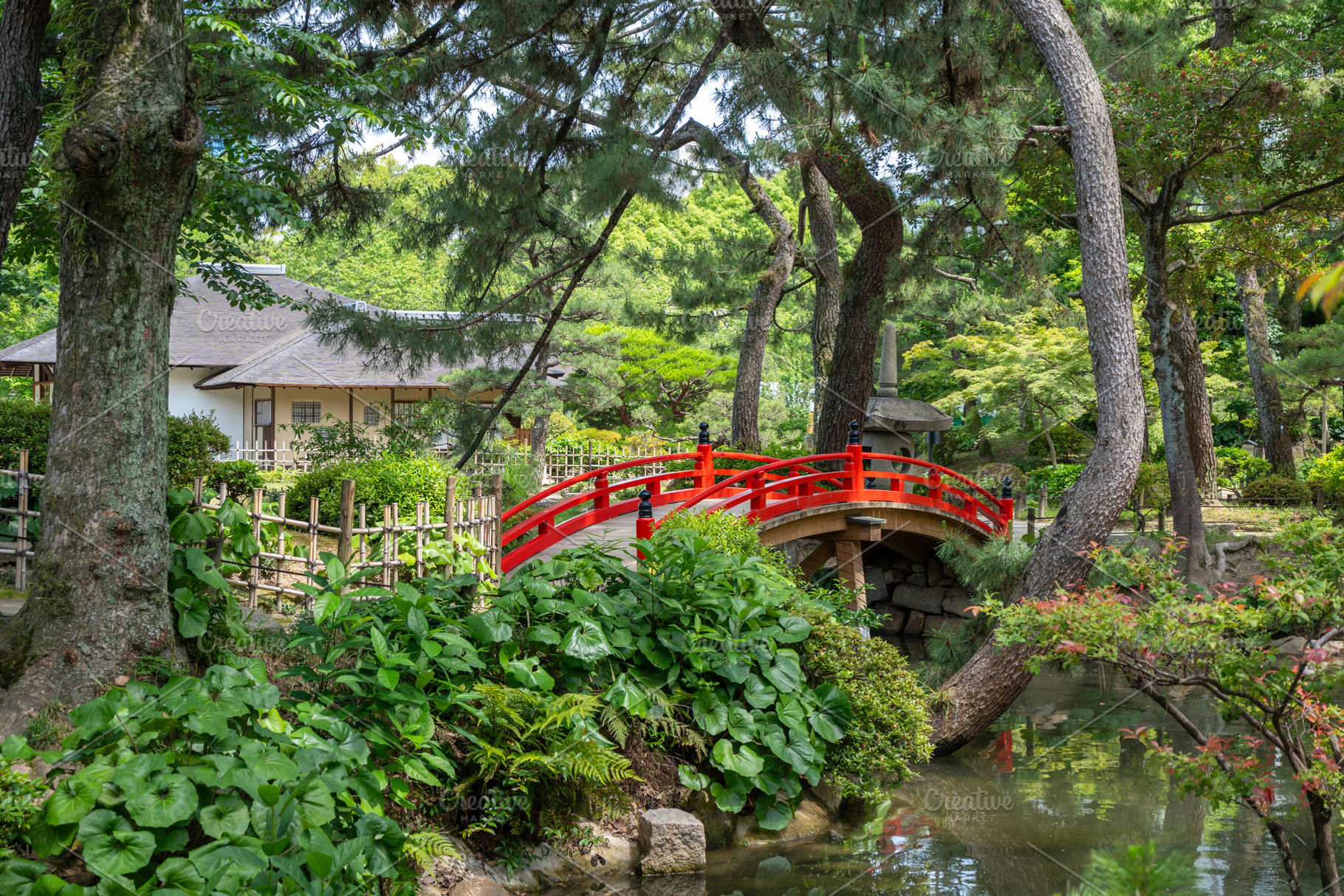 Red bridge in Shukkei-en Japanese garden in Hiroshima, Japan, an Arts & Entertainment Photo by GoodGoods