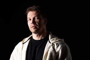 Serious man in white fleece jacket, a Person Photo by Elena Vagengeim