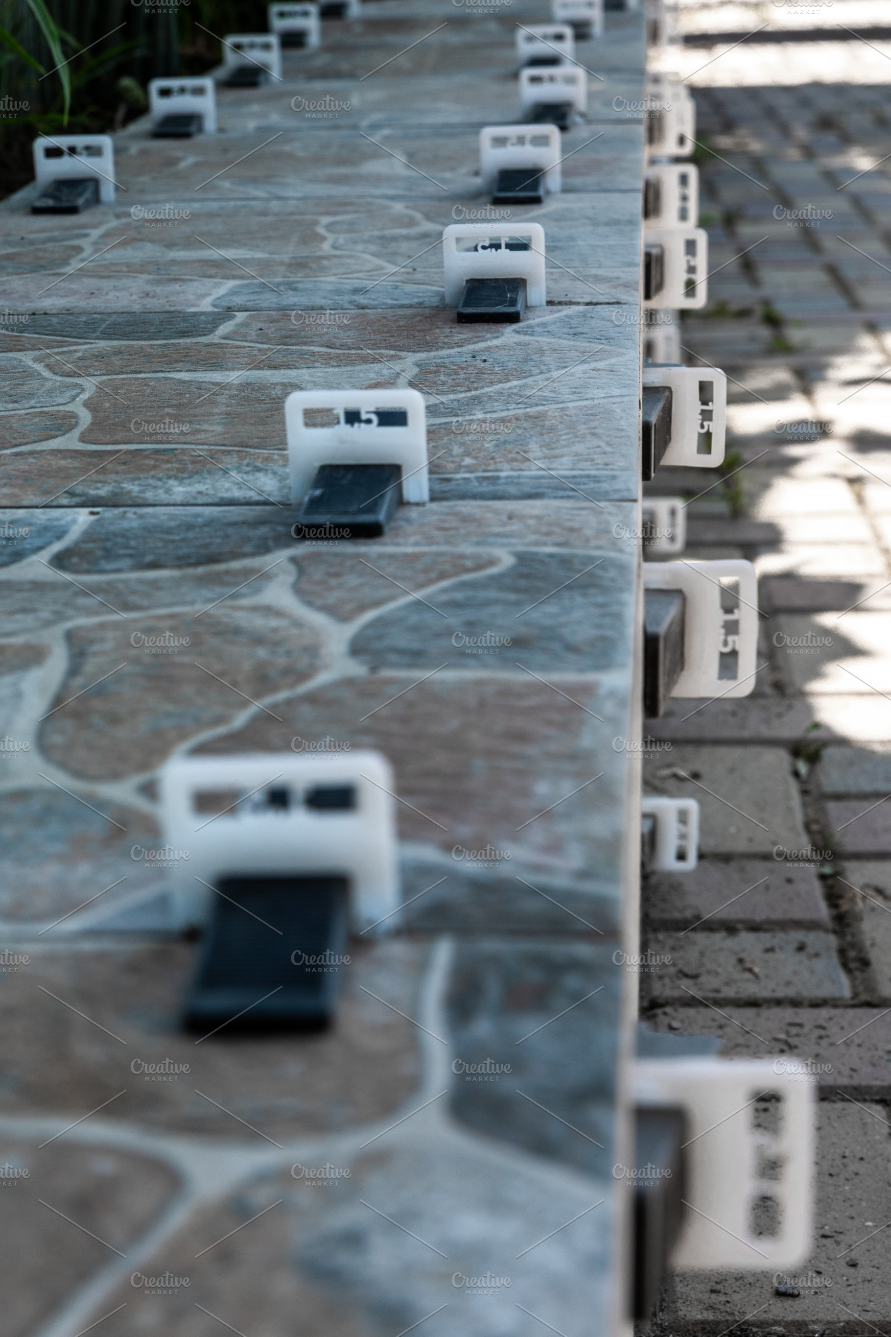 Outdoor Tile Installation Closeup, an Architecture Photo by Ales Munt