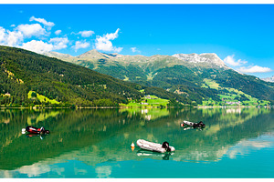 Boats on Reschensee, an artificial, a Nature Photo by Leonid Andronov