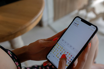 Woman typing a message to her friend