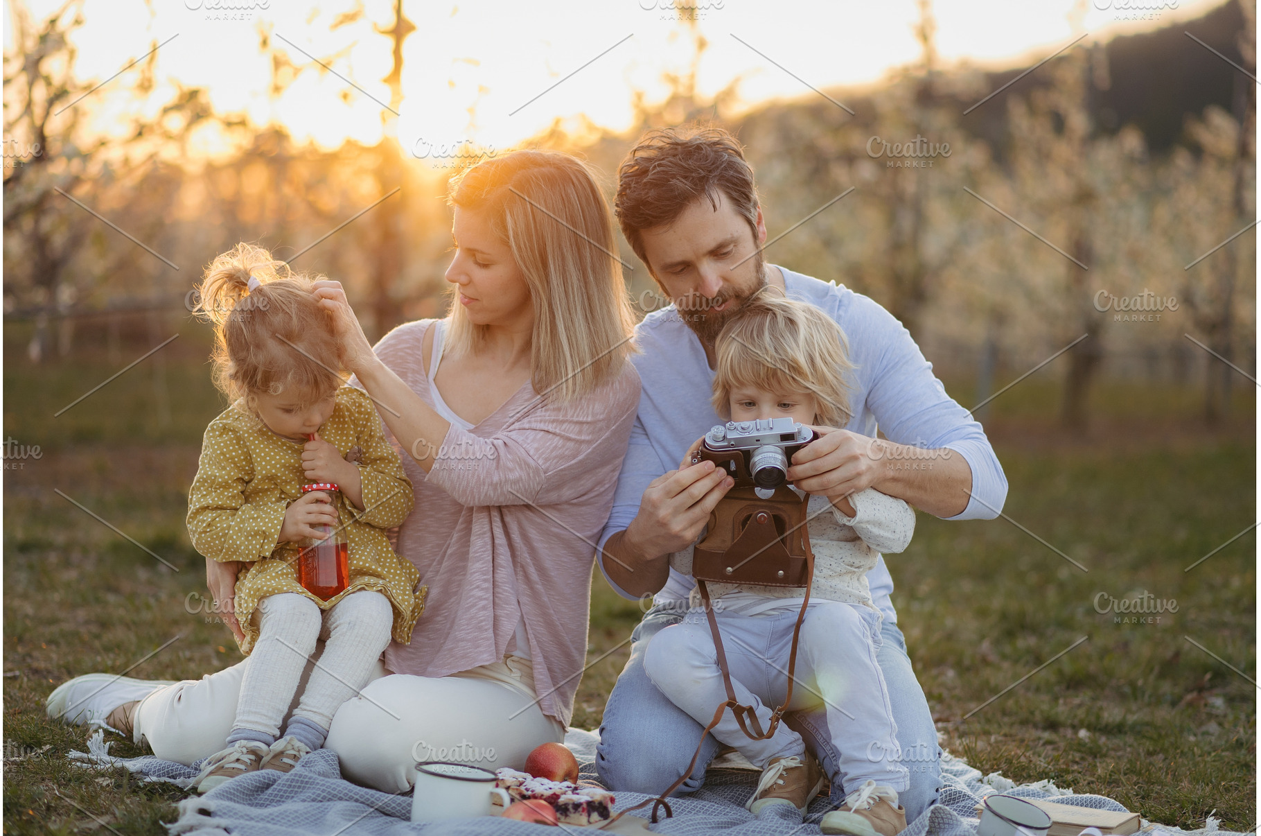 Family having picnic in spring, a Person Photo by HalfPoint