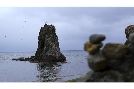 Stones on shore against background, a Nature Photo by Media Whale Stock
