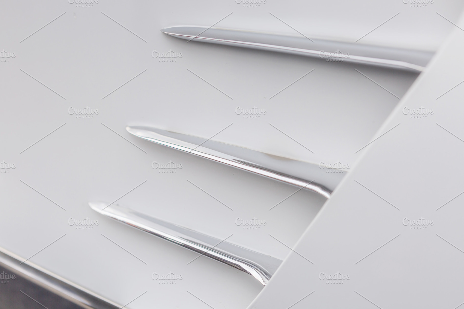 Fragment of vintage white car, a Background Photo by Photo Kaminski