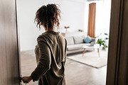 Back View Of African American Lady Opening Door Entering Apartment, a Photo by Prostock-Studio (Thumbnail 2 of 2)