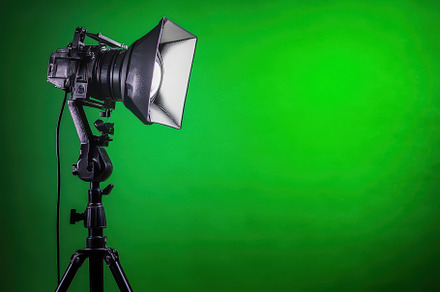 Spotlight on a tripod set against a, a Photo by Iftikhar Alam