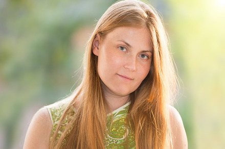 Young woman with red long hair containing woman, window, and looking, a Person Photo by Vapi