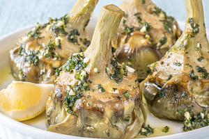 Four Roman-style artichokes served o, a Food & Drink Photo by Alexander Prokopenko