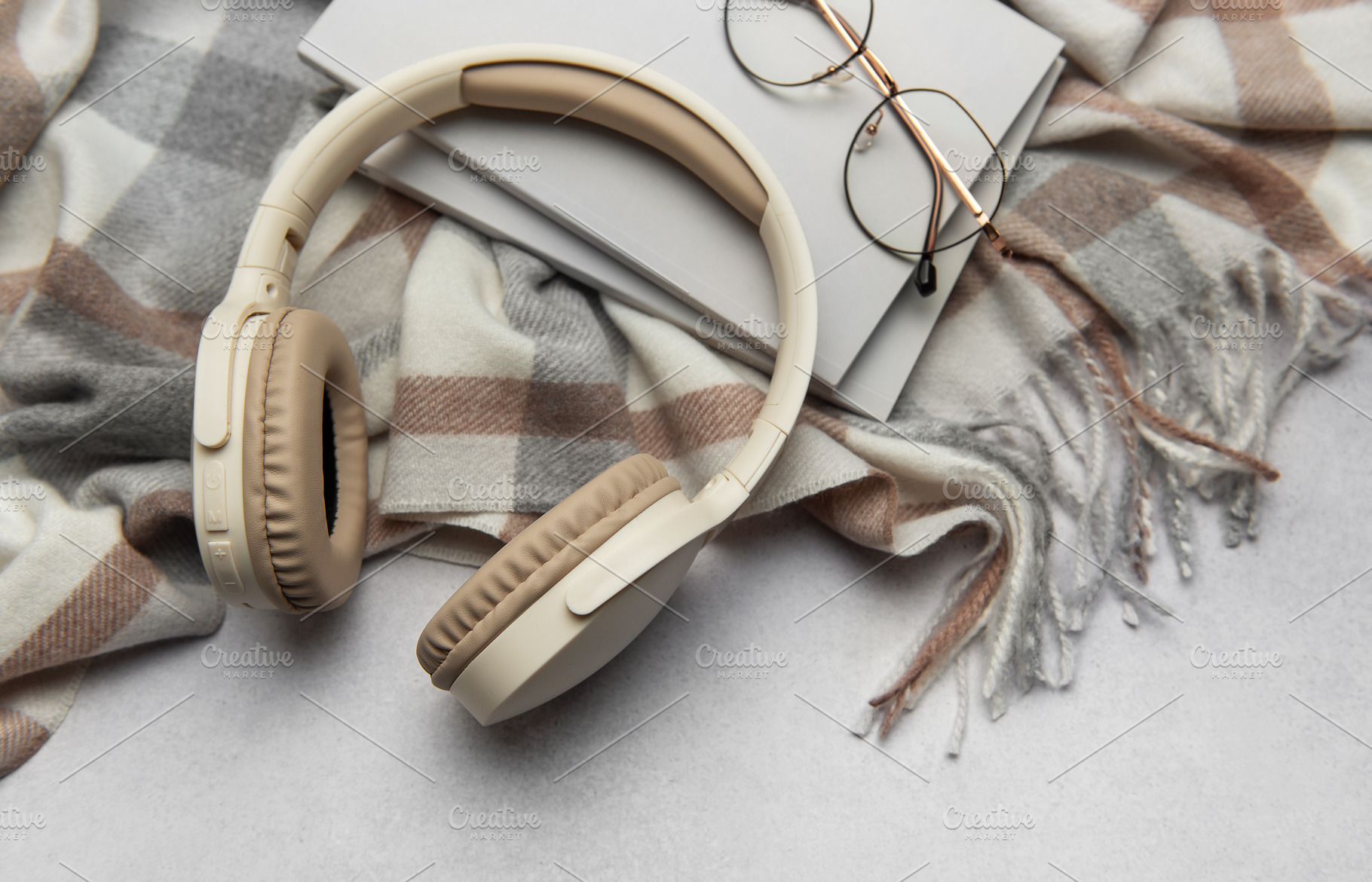 Warm plaid, headphones, book, and eyeglasses creating cozy atmos, a Technology Photo by Olena Rudo