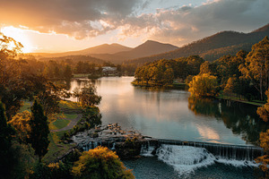 Sunset over a lake in a rural area, a Photo by Pavel_design
