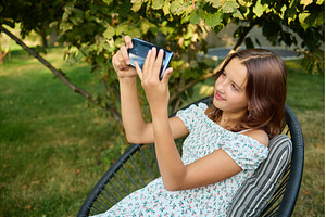 Young girl takes a selfie while, a Beauty & Fashion Photo by IlliaBondarPhotography