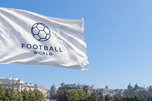 Football flag waving in city square,, a Photo by Dvoevnore photos