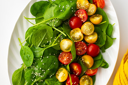 Salad with tomatoes and spinach, a Food & Drink Photo by Pandateam