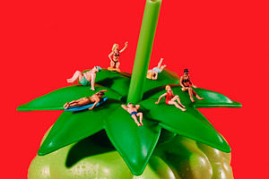 miniature people in swimwear on a green bottle, a Photo by Nito