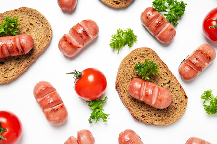 Concept of tasty food, grilled mini sausage, top view, a Background Photo by AtlasStudio